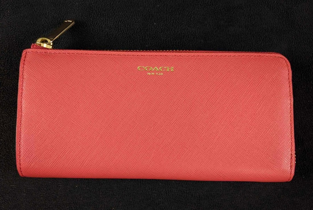 Authentic Leather Salmon Coach Wallet: Authentic Leather Salmon Coach Wallet This Coach wallet is in great condition with no known damage. This wallet is like new without tags. This coach wallet has 8 card holders, a middle compartment wi