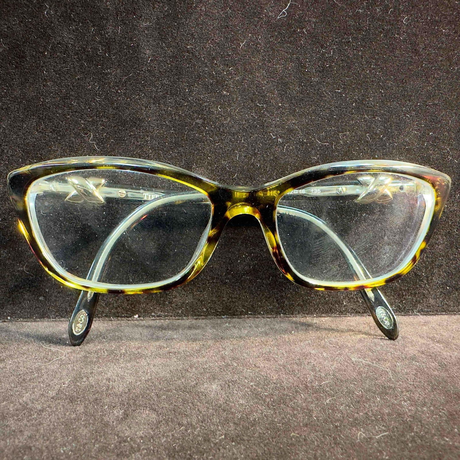 Tiffany & Co TF2074 8155 Havana On Transparent Women's Eyeglasses 52-16-135 #2: Tiffany & Co TF2074 8155 Havana On Transparent Women's Eyeglasses 52-16-135 #2. Tiffany & Co. TF2074 eyeglasses includes the Tiffany & Co. logo on the temple. The polished havana on tr