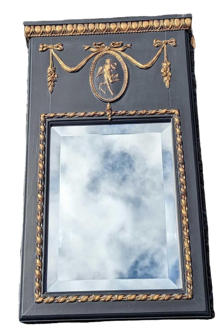 Paragon Picture Gallery Black Resin Cupid Mirror: Paragon Picture Gallery Black & Gold Resin Cupid Mirror. Is approx 16 1/2" x 1" x 29 1/2" and it weighs 7.5lbs. The mirror is in a good, used condition with some signs of wear on the frame and back. P