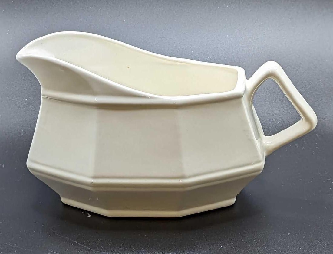 Vintage White Ceramic Milk Or Gravy Pitcher: Vintage White Ceramic Milk Or Gravy Pitcher. Its maker and date of creation. This is approximately 7" x 4" x 3 3/4" and it weighs 0.62lb. There are some markings inside the pitcher.