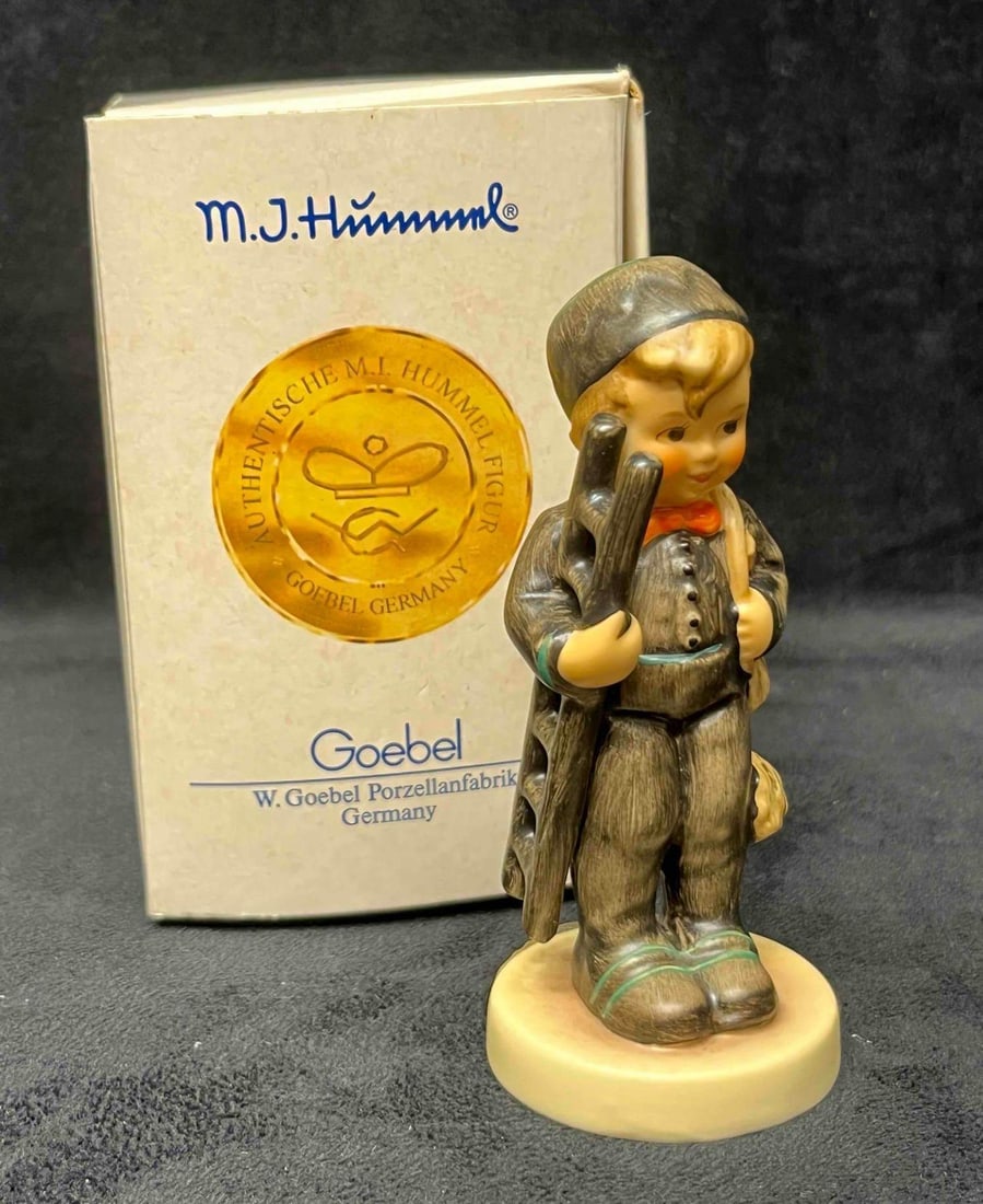 Goebel Hummel Chimney Sweep #975 In Original Box: This lot contains a Goebel Hummel Chimney Sweep #975 In Original Box. The box is approx 3" x 3" x 5". Total weighty is approx 0.2lbs. Overall the Hummel figurine is in good pre owned condition with mi