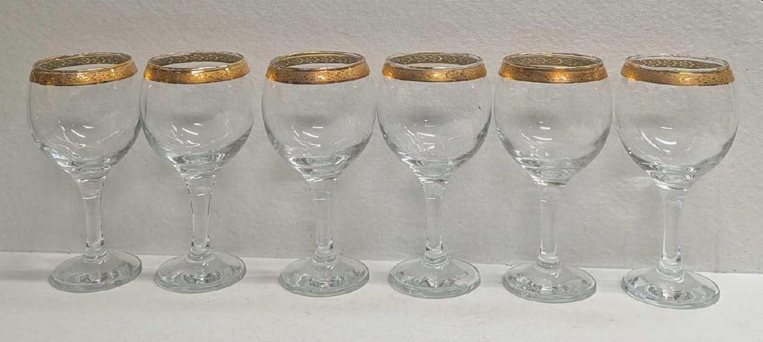 6 Gold Rimmed Glass Goblets With Renaissance Pattern: 6 Gold Rimmed Glass Goblets With Renaissance Pattern. Each glass is approx 3 1/2" x 3 1/2" x 6 1/4" and the total weight is 2.50lbs. The glasses have no chips or cracks. There is some wear and color l