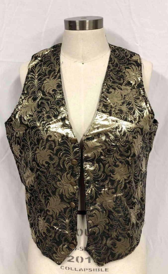 Gold & Black Paisley Style Vest From The Mickey Finn Show: This lot contains a gold and black paisley style vest from the Mickey Finn Show. The Mickey Finn Show was television series hosted by Fred Finn and his wife Mickie Finn. This vest was worn by Fred Fin