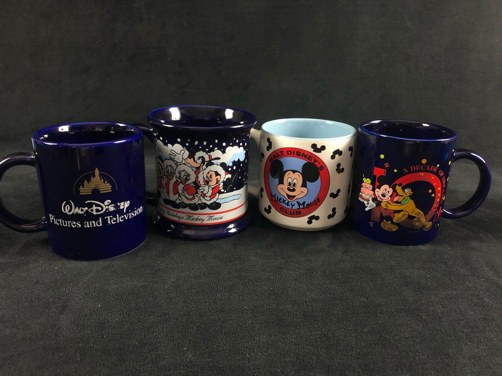 Vintage Lot Of 4 Disney 10th Yr ,Disney Television, Happy Holidays,Mickey Club Coffee Cups: Vintage Lot Of 4 Disney 10th Yr ,Disney Television, Happy Holidays,Mickey Club Coffee Cups. These cups are in very good used condition with very light smudges on bottom.