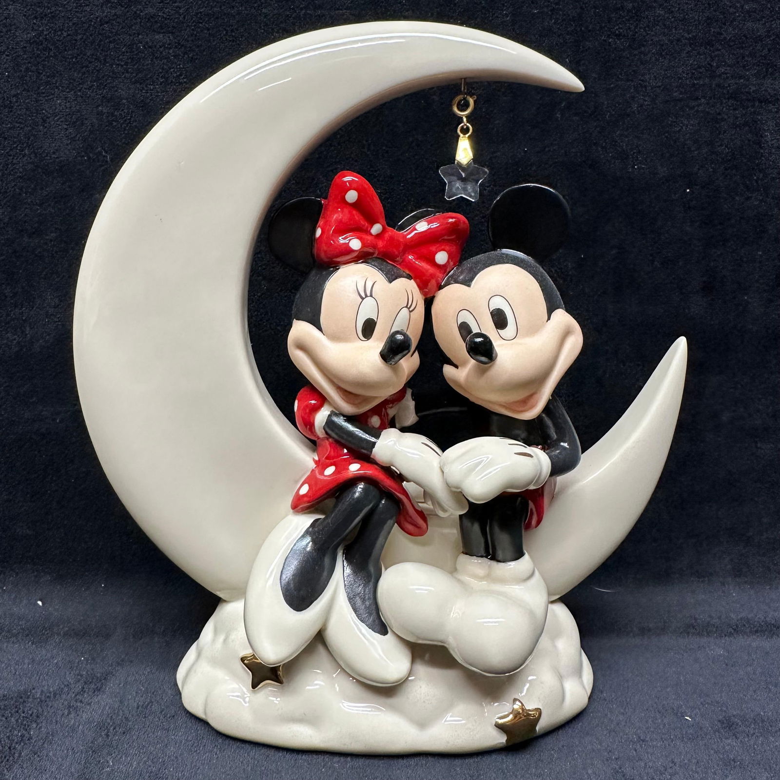 Lenox Disney Over the Moon for Minnie Porcelain Figurine Crescent Moon: Lenox Disney Showcase porcelain figurine titled “Over the Moon for Minnie.” Features Mickey and Minnie seated together on a large cream-colored crescent moon over clouds with gold-tone star ac