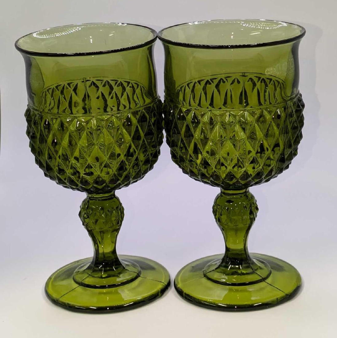 2 Vintage Indiana Green Glass Diamond Point 6" Goblets C: 2 Vintage Indiana Green Glass Diamond Point 6" Goblets c. Each is approx 3 1/2" x 3 1/2" x 6 1/2" and the total weight is 2.08lb. The pressed glass goblets have no chips or cracks.