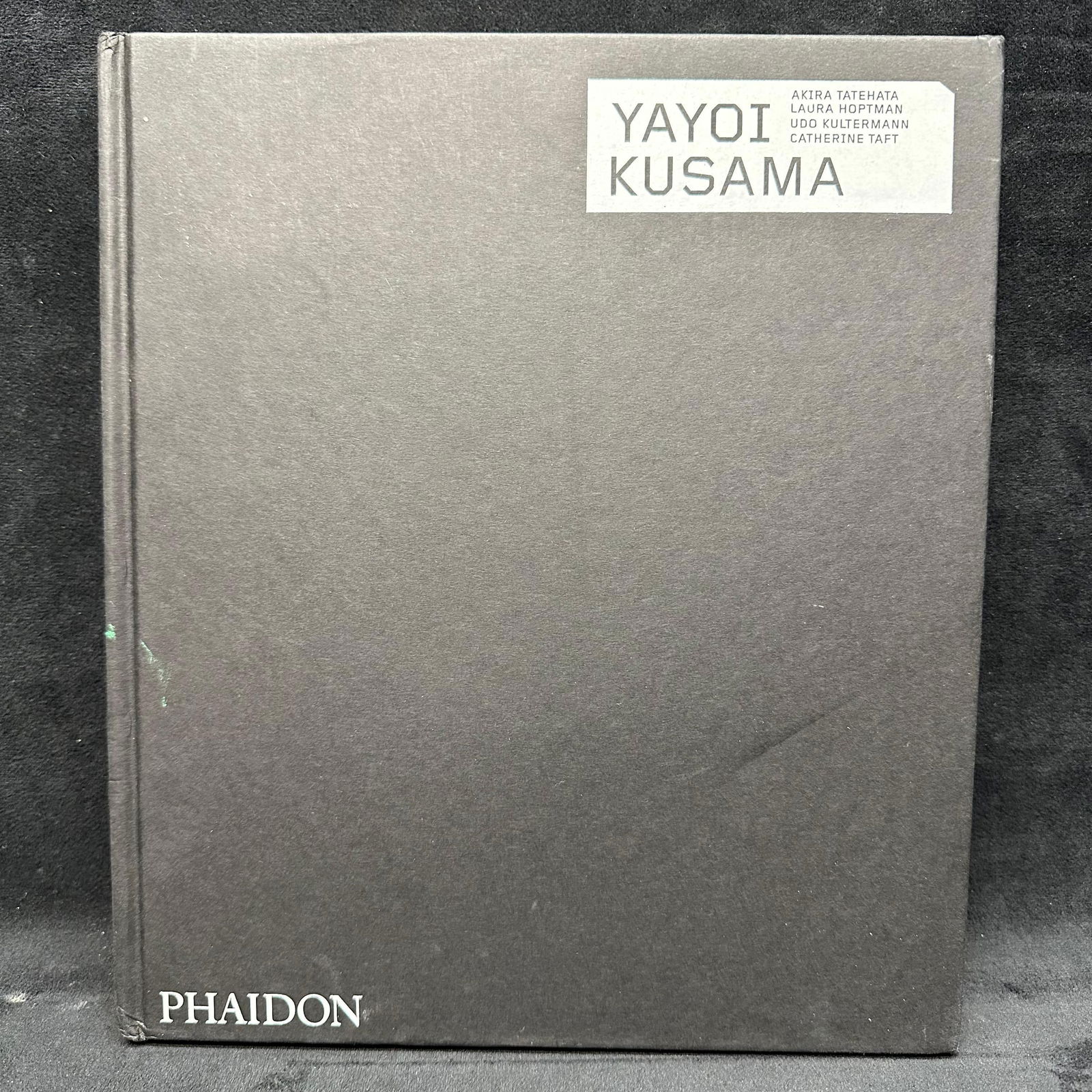 Yayoi Kusama Revised and Expanded Hardcover Monograph Black Book: Book cover and pages are in good condition, and appear to be lightly read. Minor rip on a page near the back of the book. This item is in pre-owned, previously displayed condition, with light wear and