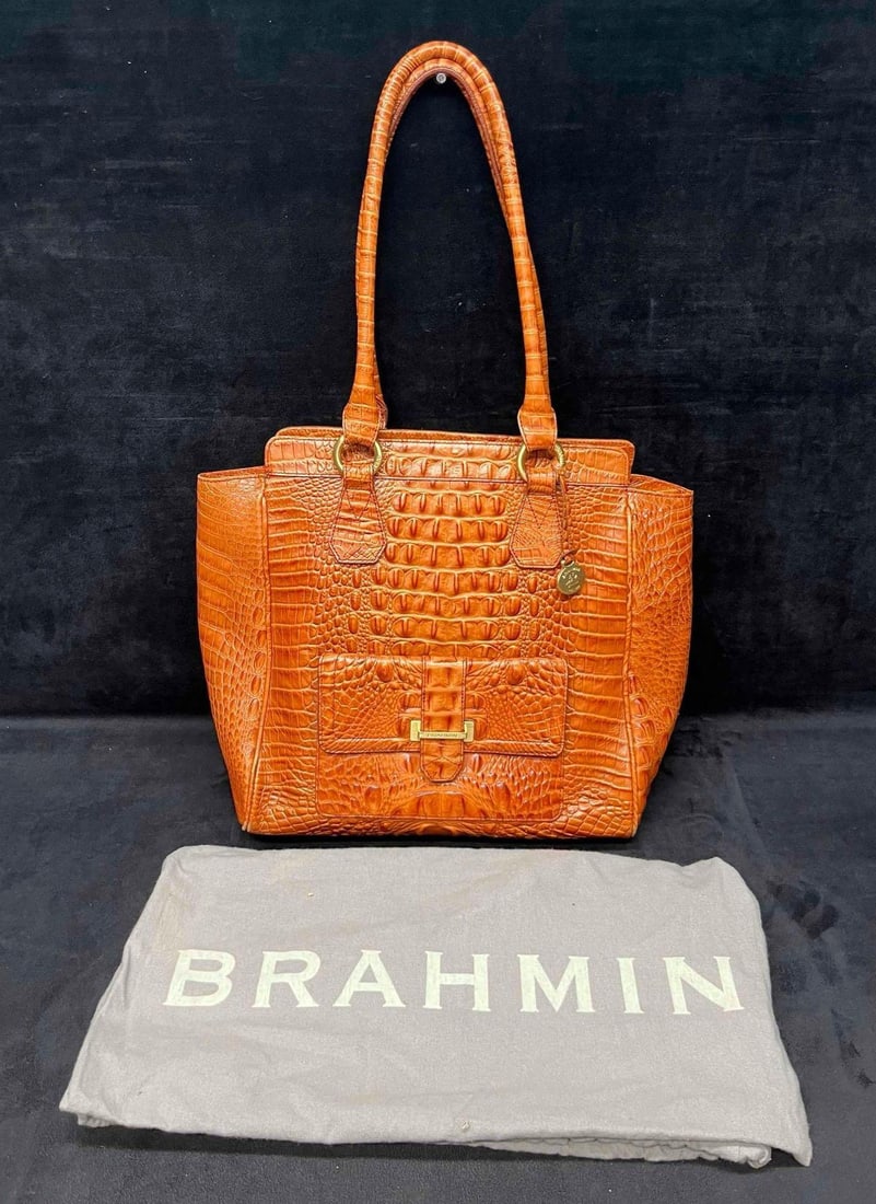 Brahmin Duxbury Satchel In Mango Orange Melbourne Leather: This lot contains a Brahmin Duxbury Satchel In Mango Orange Melbourne Leather. It is approx 12" x 14 1/2". Total weight is approx. 2.5lbs. Overall the Brahmin Satchel is in good pre owned condition wi