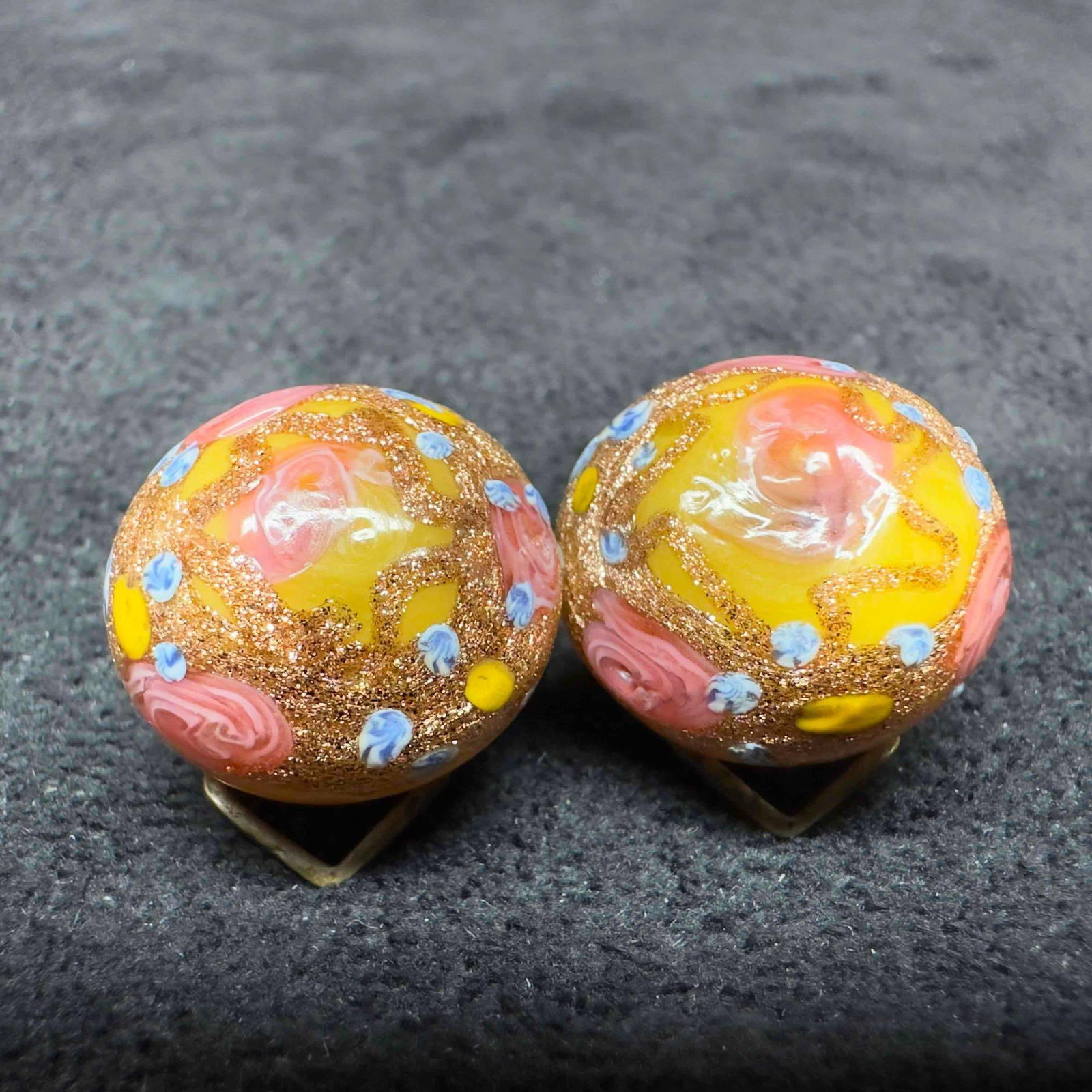 Murano Venetian Art Glass Lamp Work Yellow Round Floral Beaded Earrings D56: Murano Venetian Art Glass Lamp Work Yellow Round Floral Beaded Earrings D56. Earrings with yellow glass beads with beautiful designs on each. The earrings feature floral accents. The earrings feature