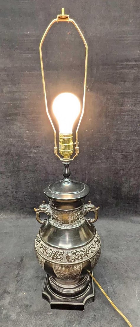 Embossed India Style Metal Vase With Elephants Lamp: Embossed India Style Metal Vase With Elephants Lamp. The lamp is approx 8" x 8" x 29". Without the harp, it is approx 19 3/4" high. The lampshade is approx 16 7/8" x 16 7/8" x 12 1/2". The lamp