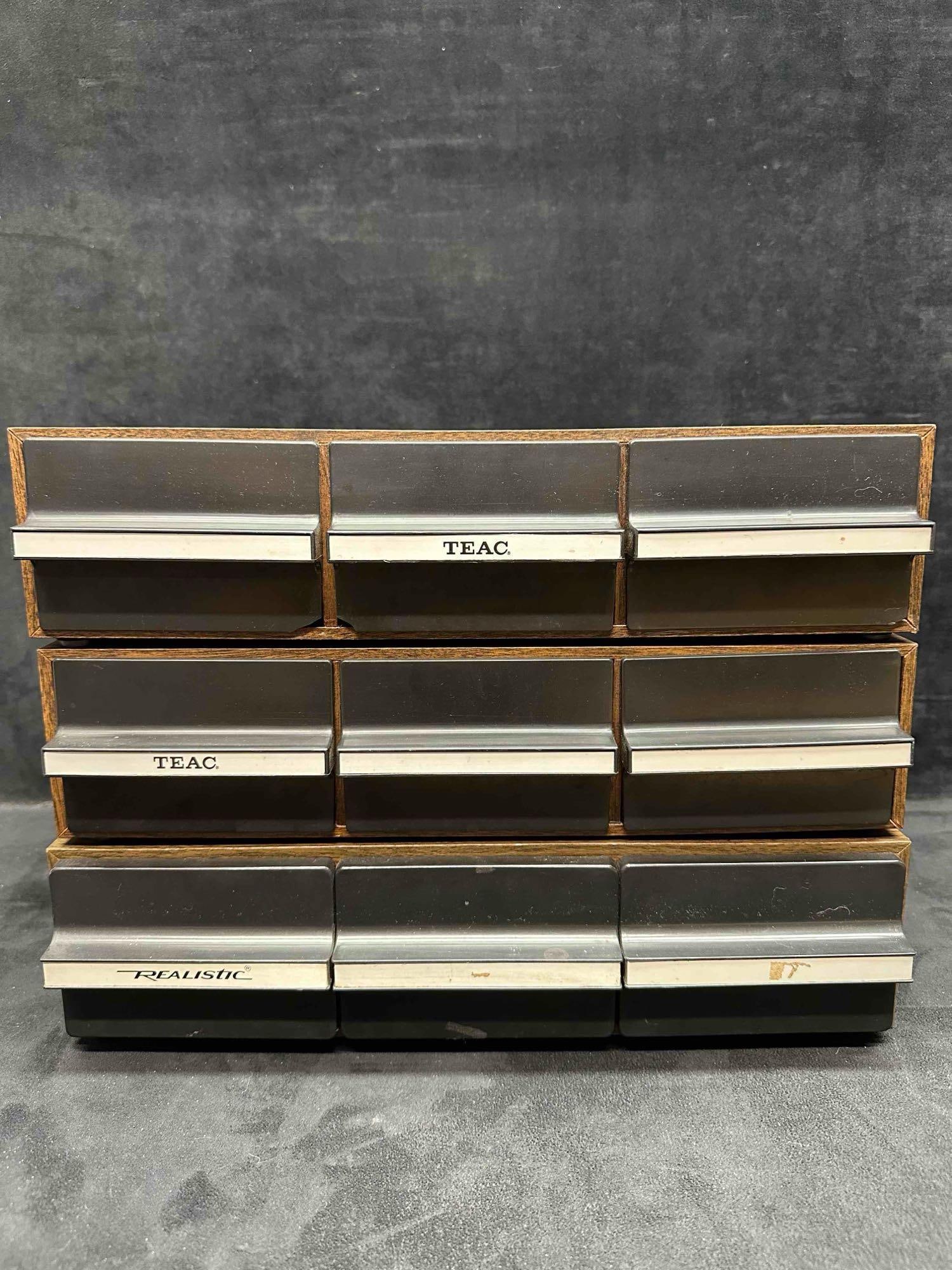 TEAC and Realistic 8-Track Tape Storage Cases Lot of 3 Wood Grain Plastic Drawer Holders: Lot of three vintage 8-track cassette tape storage holders by TEAC and Realistic. Each features a faux wood grain exterior with black plastic pull-out drawers and silver trim. Includes 3-drawer cases