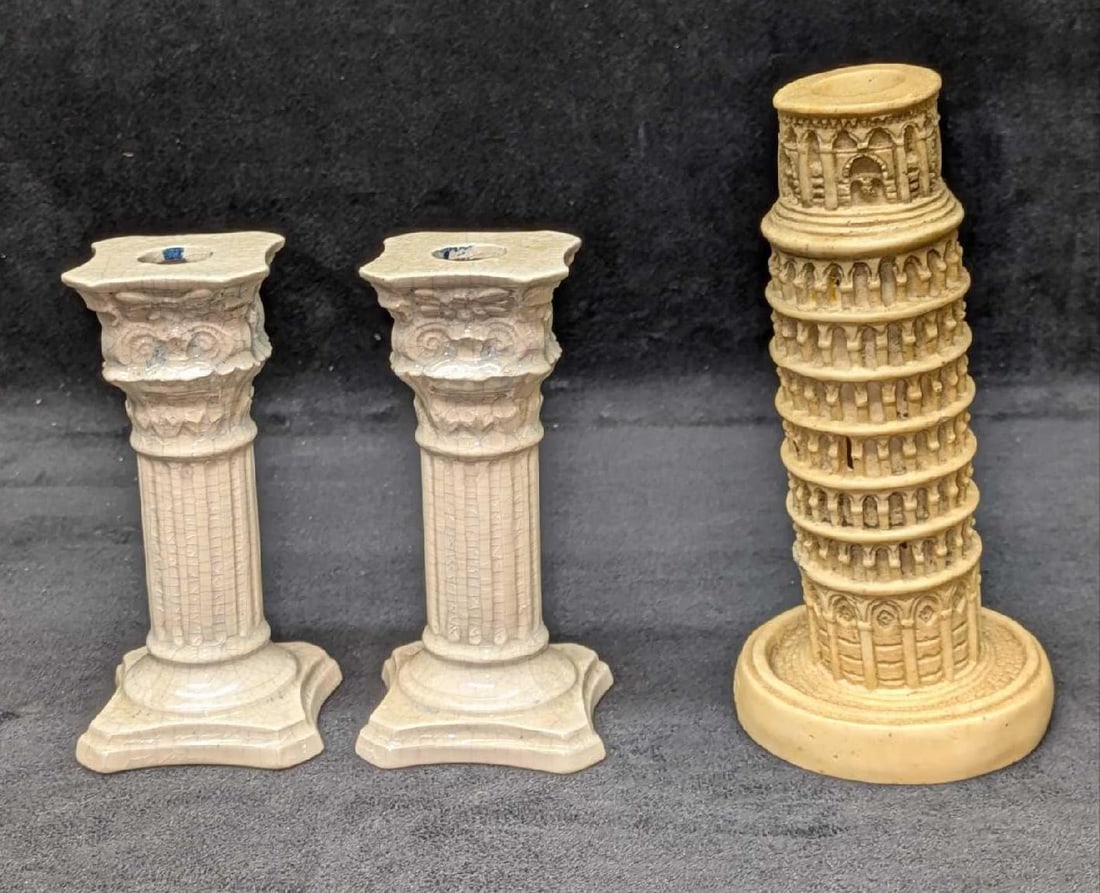 3 Vintage Roman Pillar And Leaning Tower Candlestick Holders: 3 Vintage Roman Pillar And Leaning Tower Candlestick Holders. This lot includes: (2) Crackle Ceramic Roman Pillar Candlestick Holders. Each is approx 2 3/4" x 2 3/4" x 5 1/2". There are s
