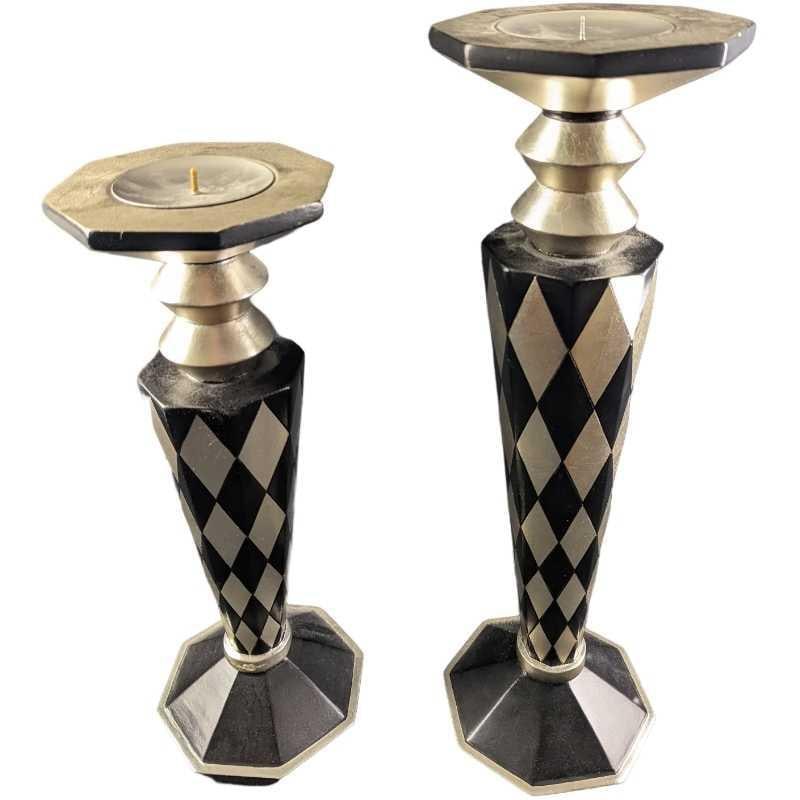 Pair Of Modern Black & Silver Wood Candlestick Holders: Pair Of Modern Black & Silver Wood Candlestick Holders. The tall candlestick holder is approx 6" x 6" x 21" and it weighs 4lbs. The smaller candlestick holder is approx 6 1/4" x 6 1/4" x 18" and it we