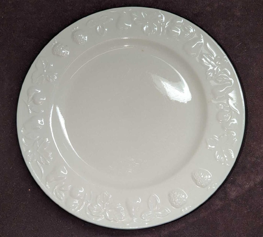 Vintage Retired Tabletops Unlimited Orchid Dinner Plate: Vintage Retired Tabletops Unlimited Orchid Dinner Plate. This plate made of china is approximately 10 1/2" x 10 1/2" x 7/8" and it weighs 1.62lb. The plate has some light markings and scratches.