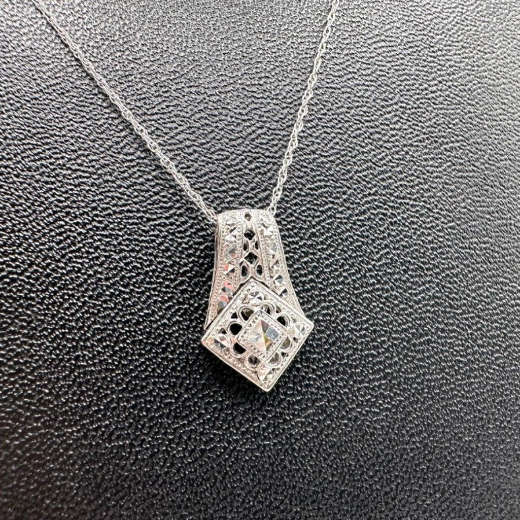 10k White Gold Deco Style Flourish Pendant Necklace: This piece of jewelry has been tested and researched prior to listing. Please view all our pictures they are part of our description. DETAILS: Metal - 10k White Gold Color - White/Silver Stones - non