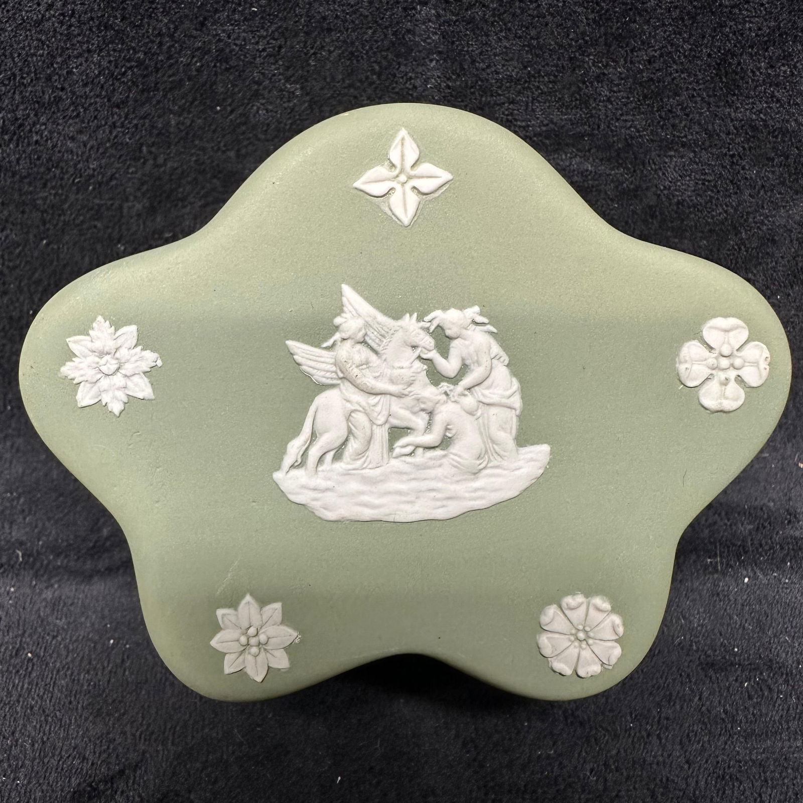 Wedgwood Green and White Jasperware Star Shaped Trinket Box: A green trinket jewelry pin box, Wedgwood, and their Jasperware range. Engraved on the bottom is Made in England Wedgwood. The piece is green and white in color and also has a unique design. The item