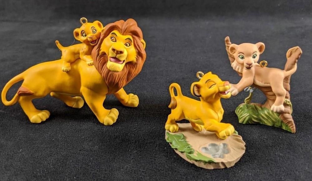 Two Hallmark Keepsake Disney Lion King Ornaments: This lot includes: 1.Mufasa And Simba. Mufasa, the gentle, wise ruler, introduces his son Simba to the majestic Pride Lands Of Africa. Ornament is in good, used condition with no known damage. Figure 