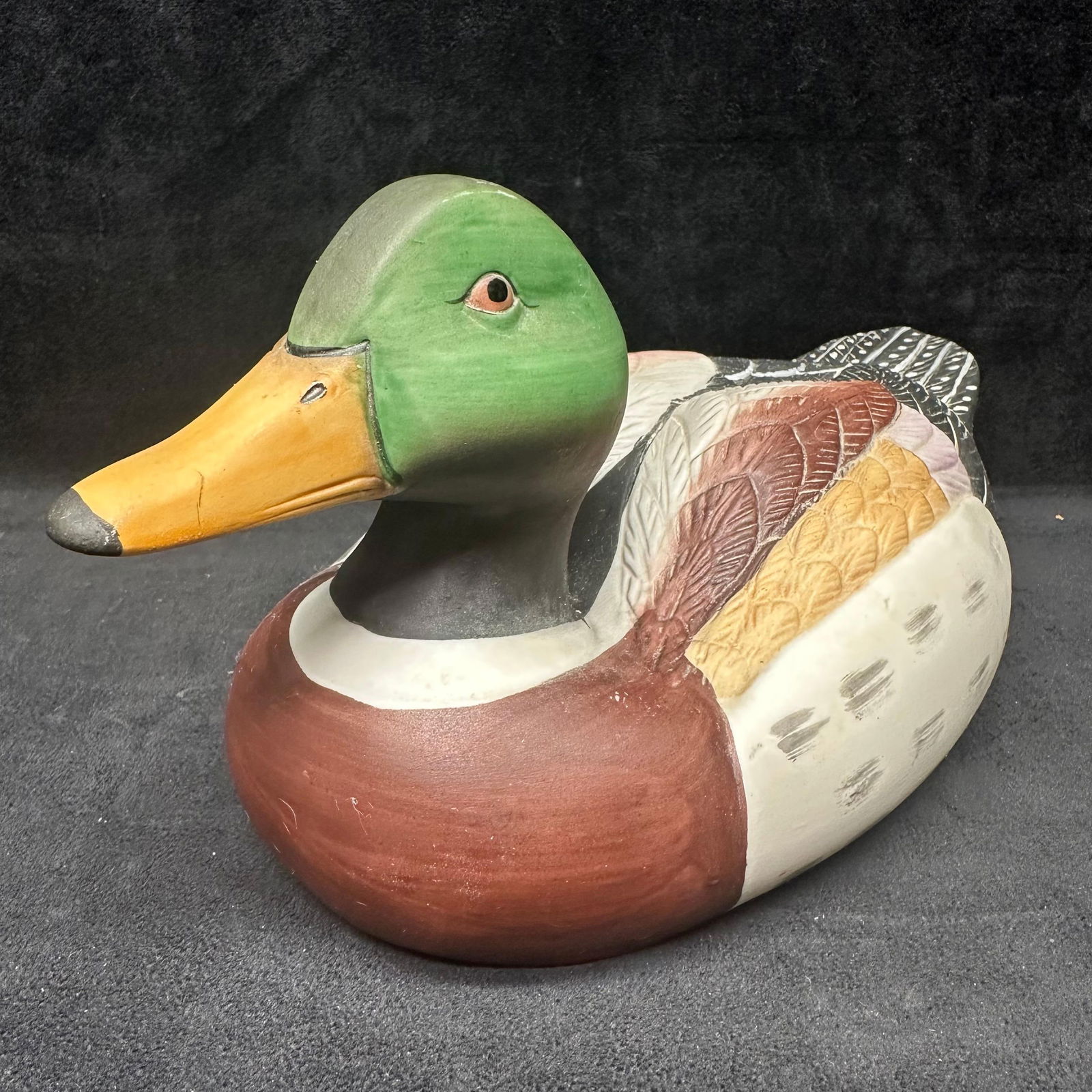 Hand Painted Ceramic Mallard Duck Decoy Figure: A vintage hand-painted ceramic Mallard duck decoy figure, finely detailed with naturalistic coloring. The piece features a green head, yellow bill, and multicolored feathered body with carved and pain