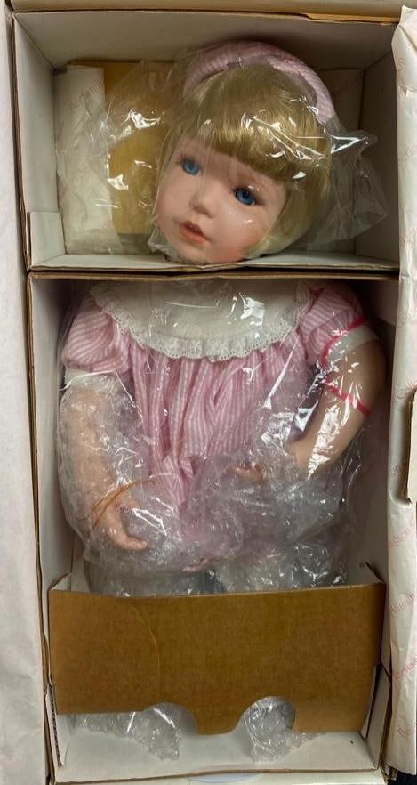 Hamilton Collection Porcelain Doll - Kaitlyn: Hamilton Collection Porcelain Doll - Kaitlyn This porcelain doll was originally released in association with the Adam Walsh Children's Fund. The doll comes in its original packaging, and has nev