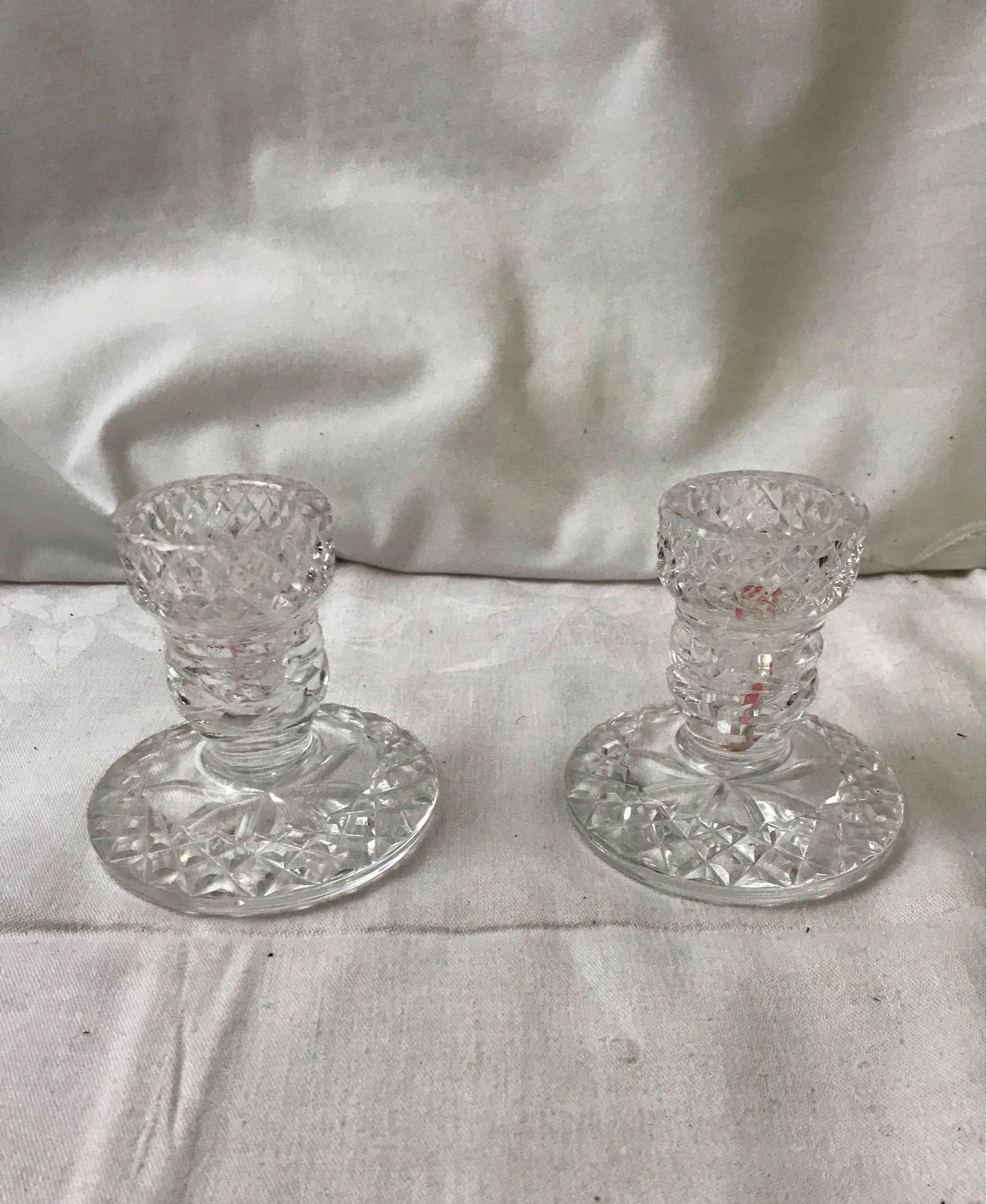 Pair Of Glass Taper Candle Holders: Pair Of Glass Taper Holders; Classically styled candlestick holders. Each measure at approximately 3 1/2" H x 3 1/2" D.