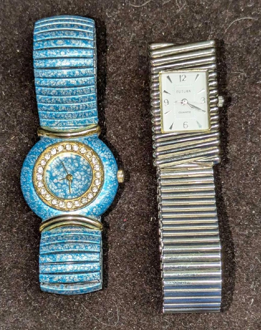 Two Ladies Stretch Watches: Two Ladies Stretch Watches. This lot includes: (1) Futura Stainless Steel Stretch Ladies Watch. Japanese Movement. This is approx 7/8" x 1/4" x 3". (1) Unmarked Aquamarine Color Stretch Rh