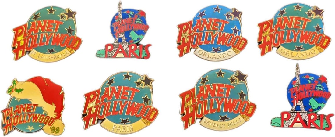 Eight Metal Planet Hollywood Pins: This lot consists of: (2) Planet Hollywood Orlando. (2) Planet Hollywood Paris. (1) Planet Hollywood Beverly Hills. (1) Planet Hollywood Ft Lauderdale.