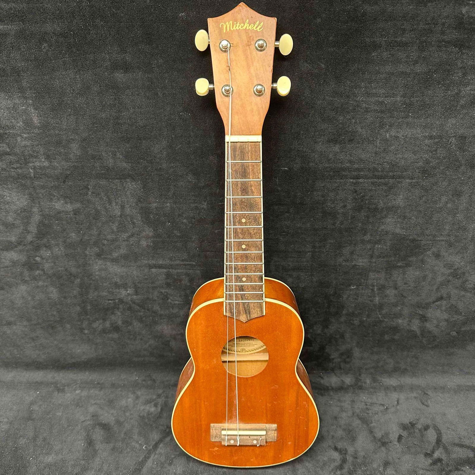 Mitchell MU40NT Soprano Ukulele Natural Wood: The Ukulele is missing two strings and has minor scratches on the wood. This item is in good pre-owned, previously displayed condition with light wear, and surface scratches. Please reference all phot