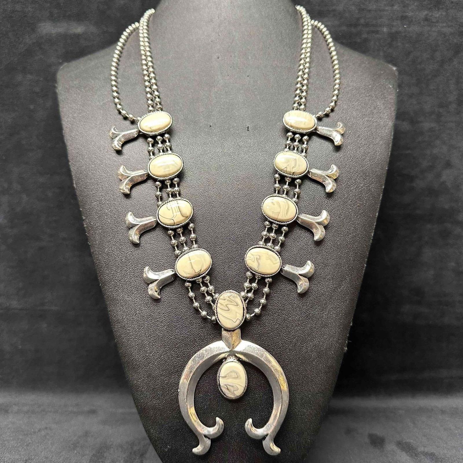 Western Style Costume Jewelry Necklace Enamel Stone Squash Blossom Design: Non marked, maker unknown, costume jewelry necklace. Enamel faux stone squash blossom necklace accents. This item is in good pre-owned, previously displayed condition with light wear, and surface scra