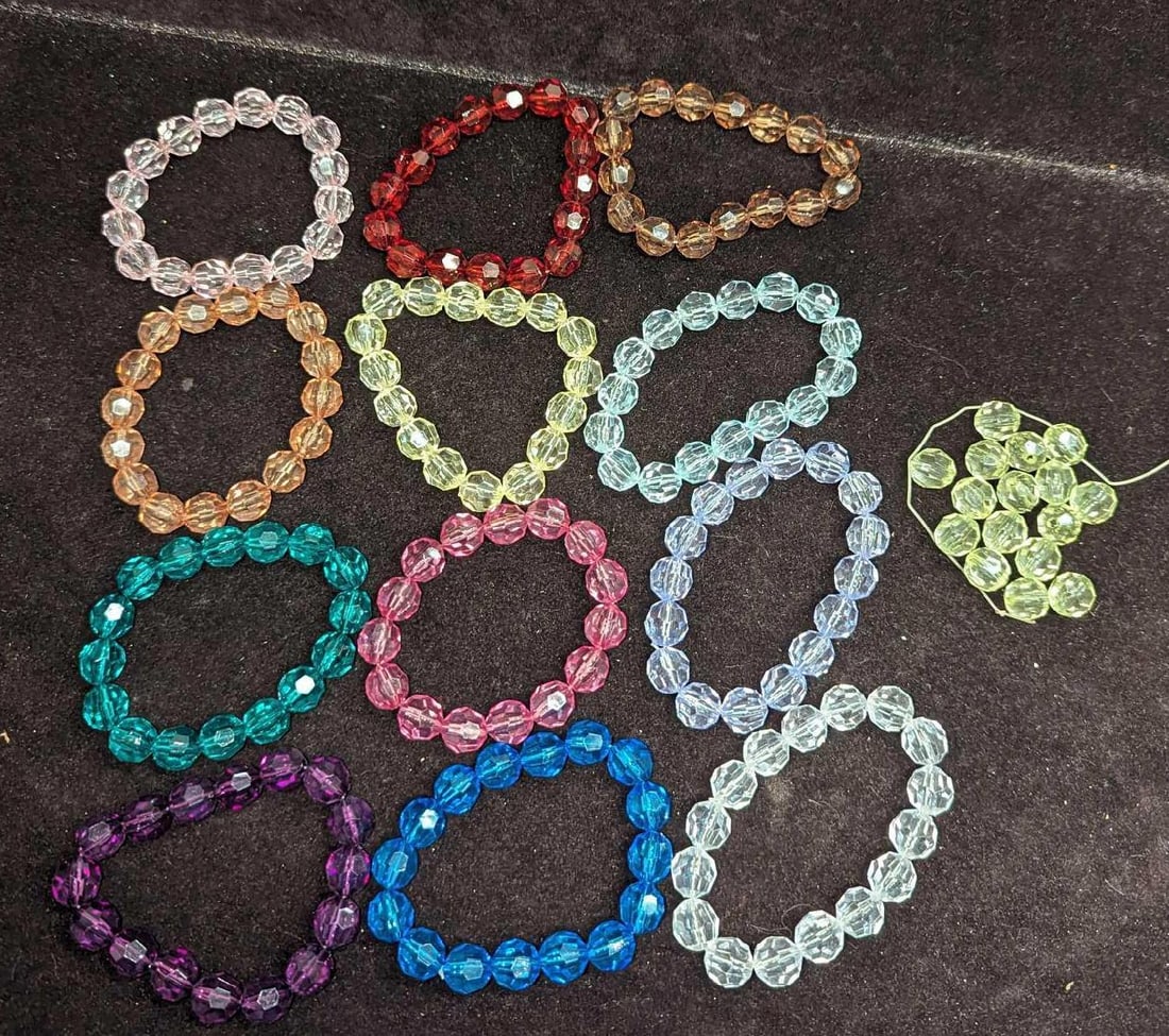 12 Assorted Colorful Elastic Acrylic Bracelets: 12 Assorted Colorful Elastic Acrylic Bracelets. Also comes with a 13th bracelet that came apart and the beads are loose. Each is 3" and all come in a package that is 4" x 1 1/2" x 5" and the weight is