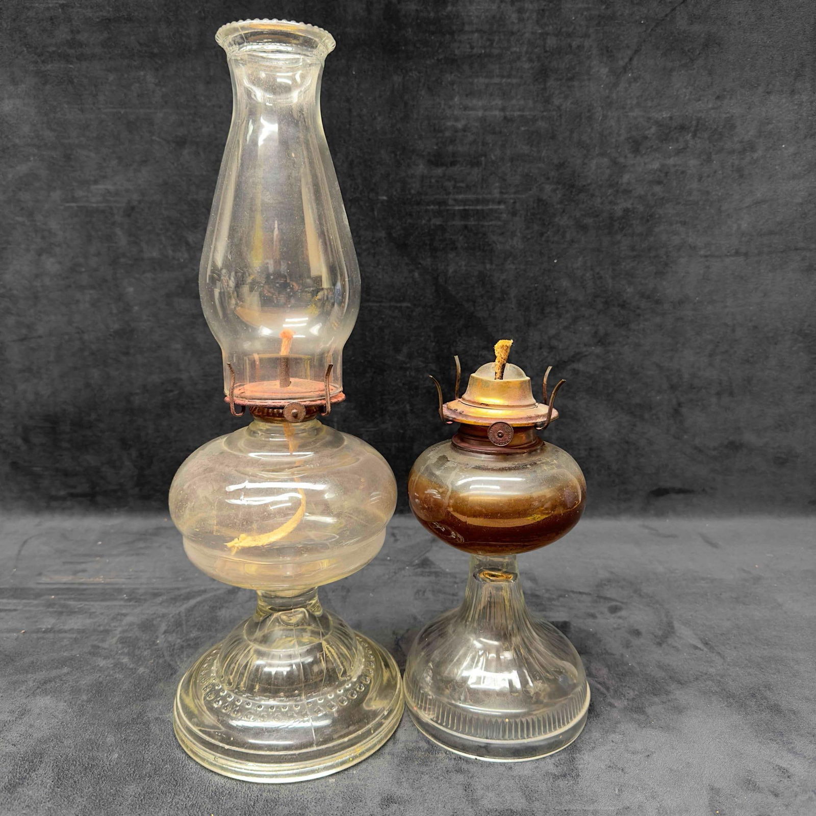 Antique Glass Oil Lamp Lantern Lamplight Set of Two 2 Hurricane Waterbury CT.: Antique Glass Oil Lamp Lantern Lamplight Set of Two 2. Waterbury CT. Assorted glass and brass oil-burning lamps, including two glass oil lanterns one without it's hurricane glass tops (base only).