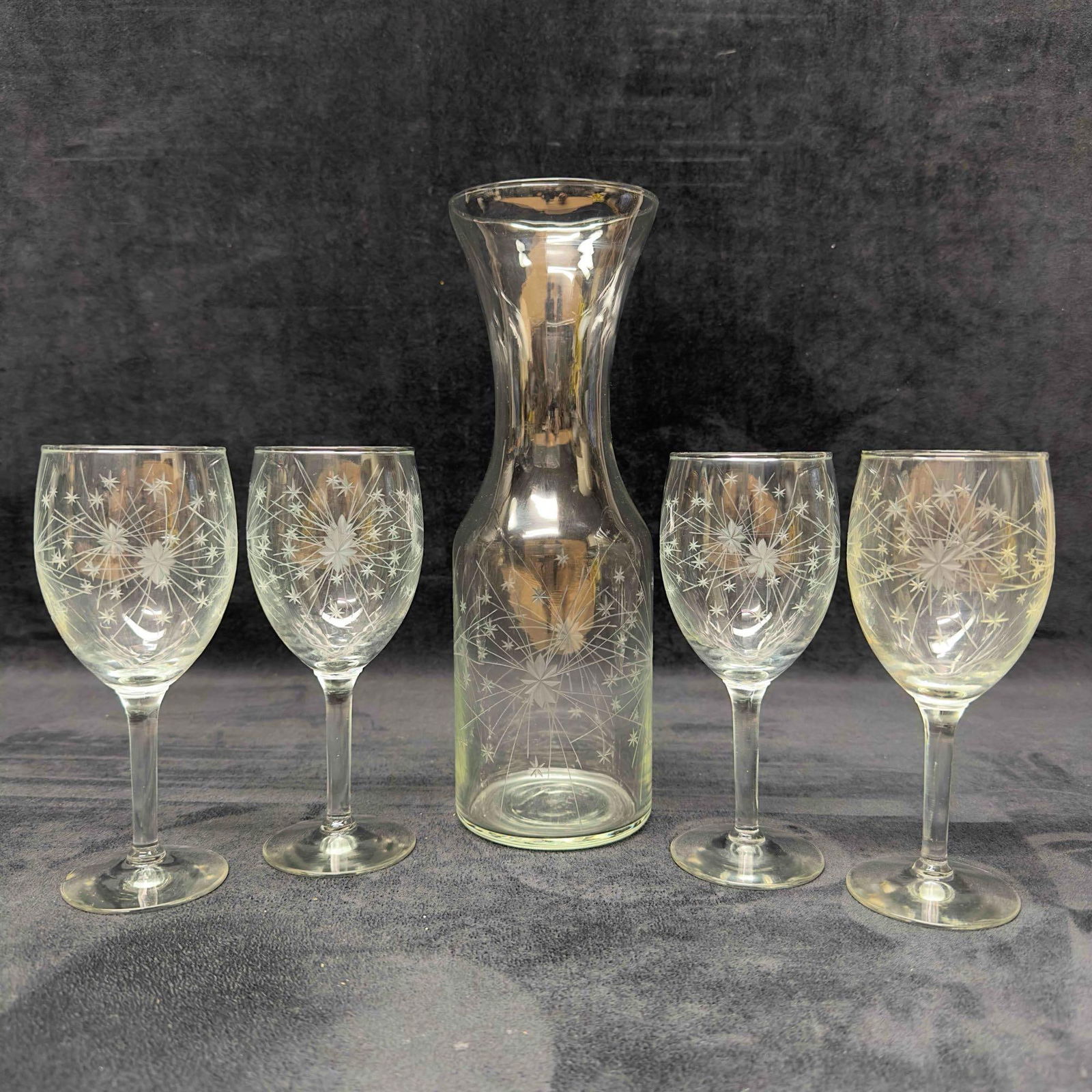 Starburst Etched Glass Pitcher Four Wine Glasses Cups Star Burst: Starburst Etched Glass Pitcher and Four Wine Glasses Cups Star Burst. This set includes a pitcher and four wine glasses with a beautiful starburst design all over. Each piece has a nice etched glass d