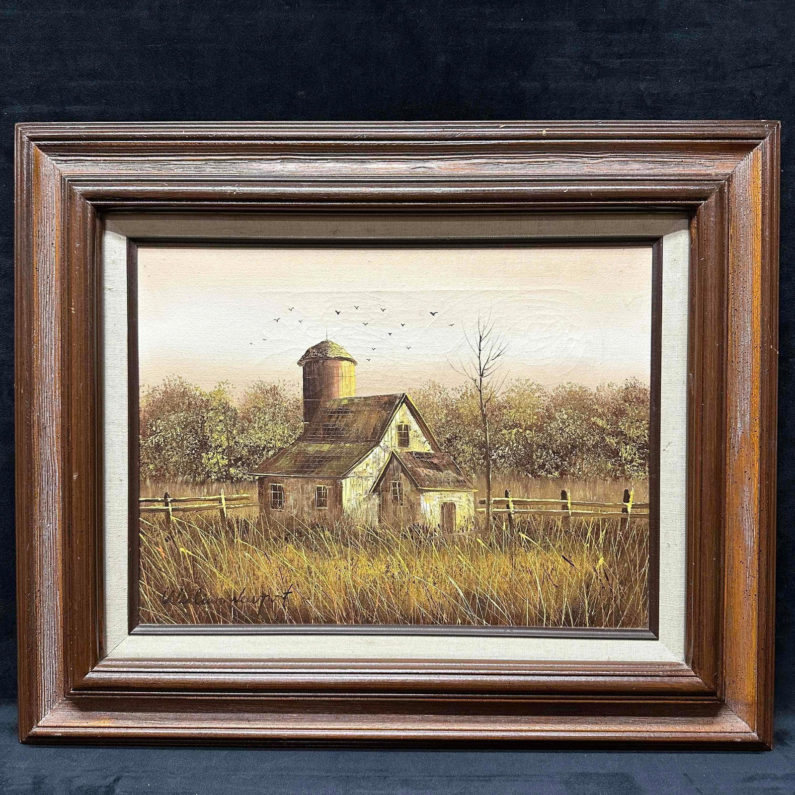 William Newport Original Oil on Canvas Rustic Farmhouse Barn Framed Artwork Painting R145: The painting portrays a charming, weathered farmhouse nestled amidst a field of tall, golden grass. The structure features a cylindrical silo, a sloping roof, and several windows, all rendered in warm