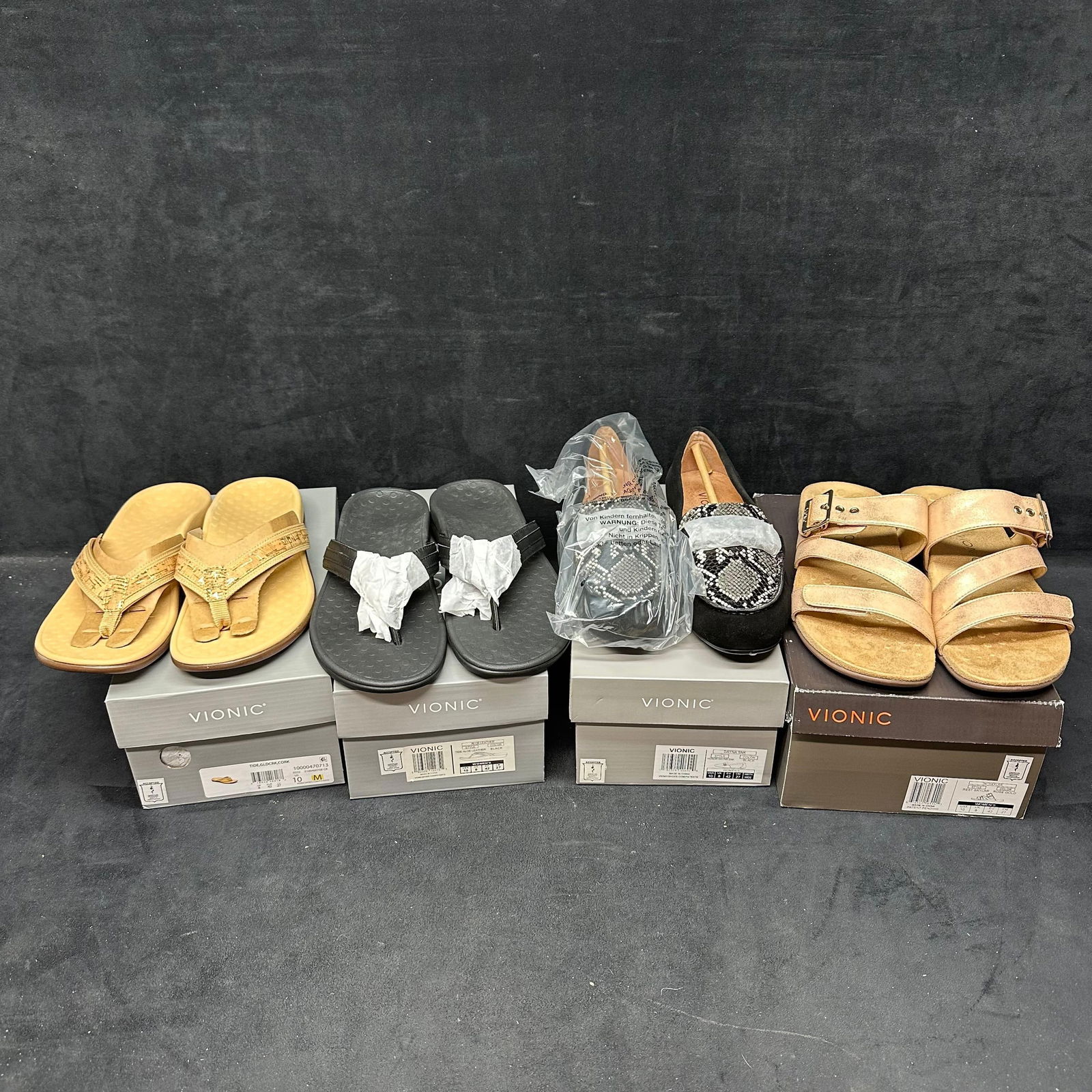 Women’s Vionic Shoes Loafers and Sandals Lot of Four Pairs: An assorted group of four pairs of women’s Vionic footwear, including thong sandals, slide sandals, and loafer-style flats. Various colors and styles as shown, several appear unworn and include orig