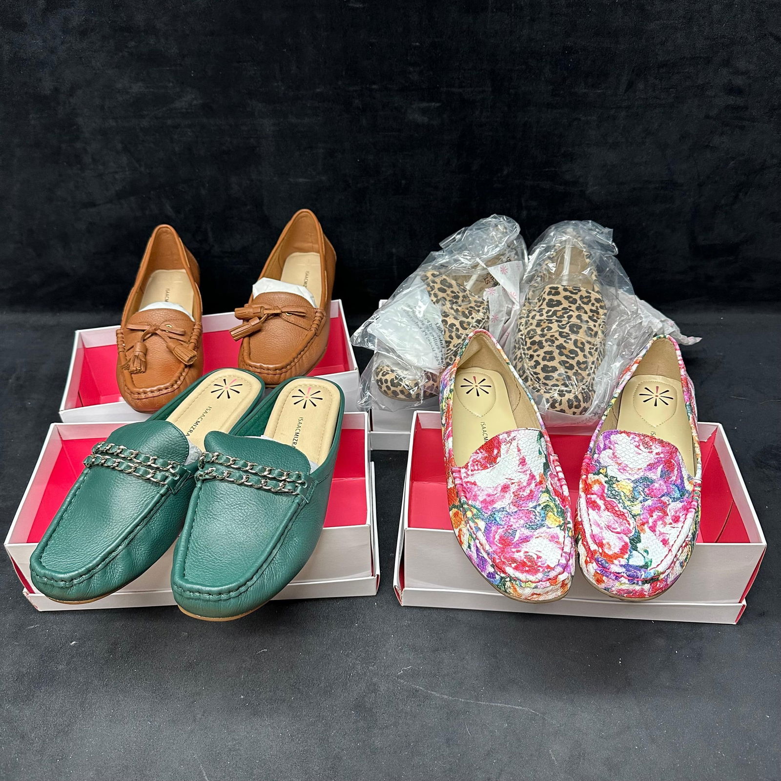 Lot of Four Women’s Isaac Mizrahi Live Leather and Fabric Loafers: Collection of four pairs of womens Isaac Mizrahi Live loafers, all new in boxes. Styles include: Aislinn medium brown leather 9.5M, Amanda medium green leather 10W, Angelica pink multi floral leather