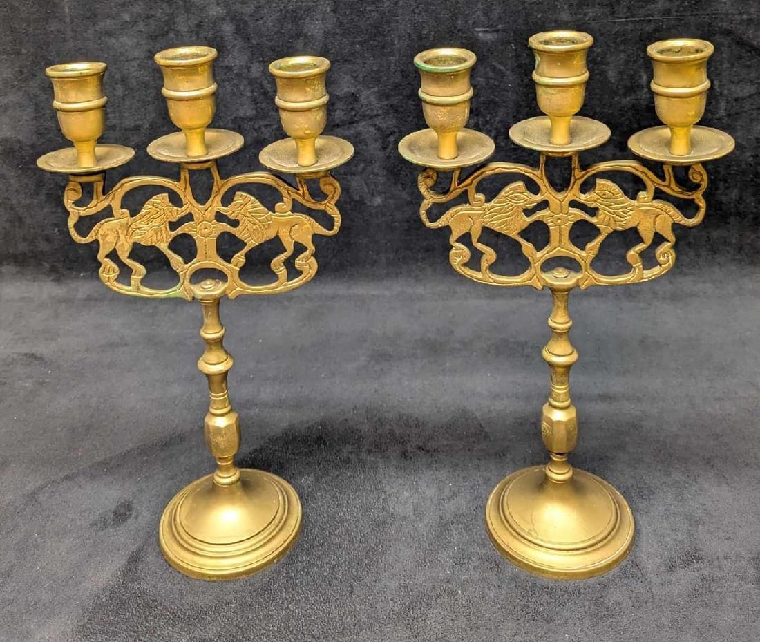 Pair Of Vintage Lions Of Judah Shabbat Candelabras: Pair Of Vintage Lions Of Judah Shabbat Candelabras. Each is approx 6 1/2" x 3 1/2" x 11 3/4" and the total weight is 3.80lbs. The candle holders have some wax residue, the brass has some light tarnish