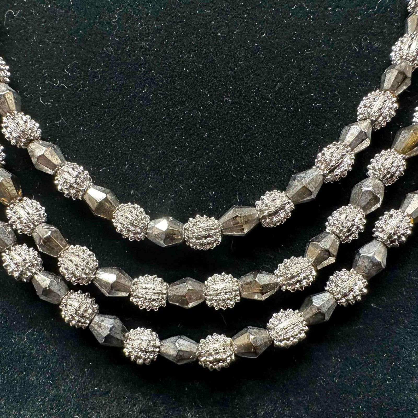 Trifari Electra Collection Three Strand Silver Nub Textured Beaded Necklace B1: Crown Trifari electra collection necklace with J-hook clasp closure. This item is in good pre-owned, previously displayed condition with light wear, and surface scratches. Please reference all photos