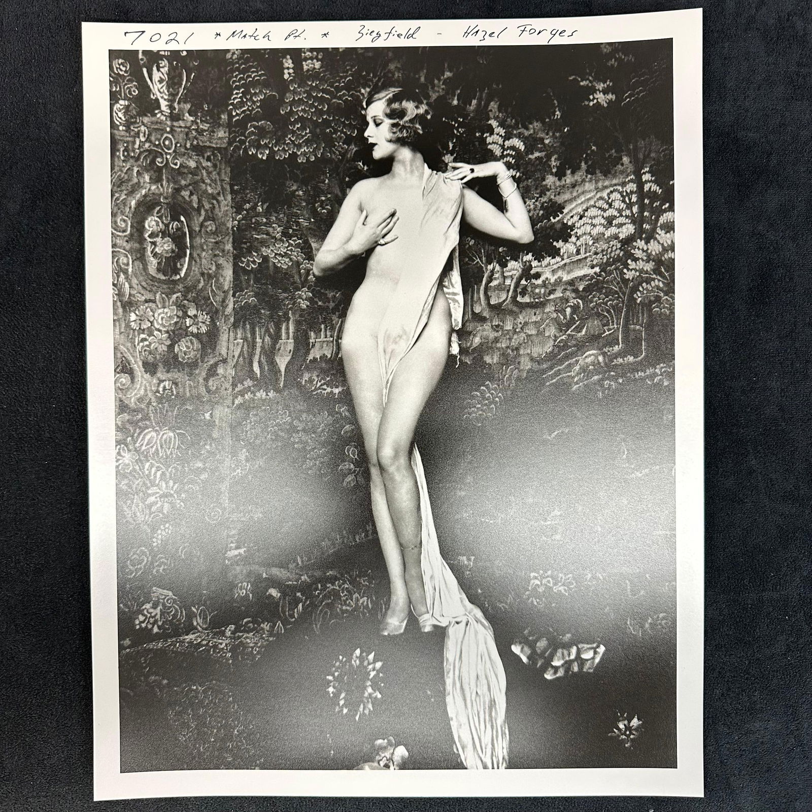 Analog Photo Print Hazel Forbes Ziegfeld Model Black and White: Black and white analog photo print featuring Hazel Forbes, noted Ziegfeld model and actress, posed against a richly patterned backdrop. Striking composition with draped fabric, showcasing the elegance