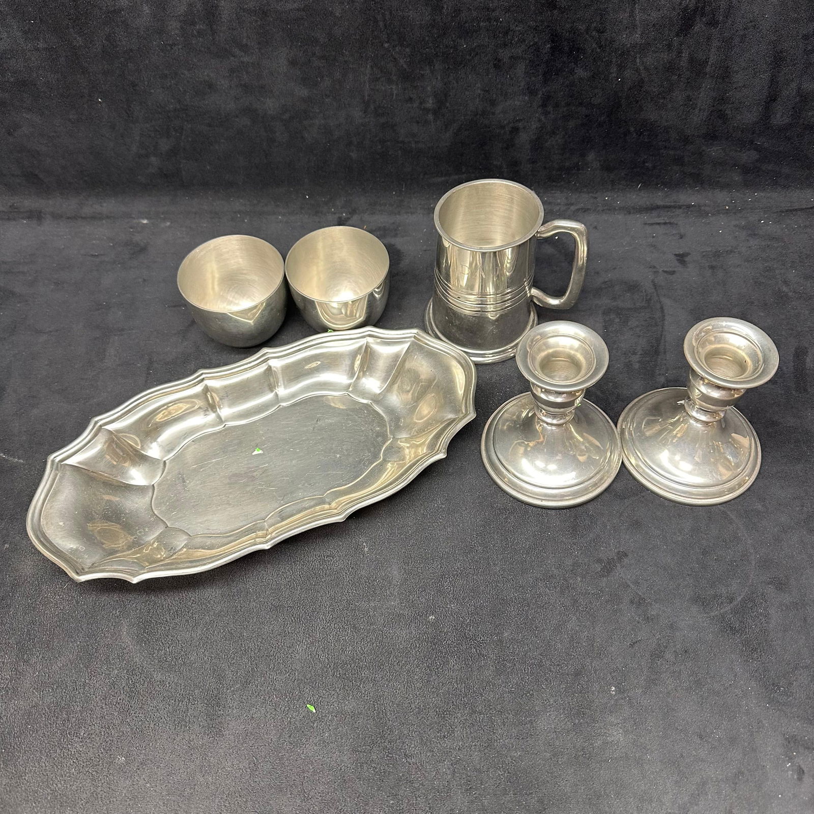 Kirk-Stieff and Various Pewter Tableware Group Including Tankard Cups Candlesticks and Tray: Group of Kirk-Stieff and other branded pewter tableware, including one handled tankard engraved DAJ, a pair of matching candlesticks, two small cups, and one oval serving tray with molded rim. Several