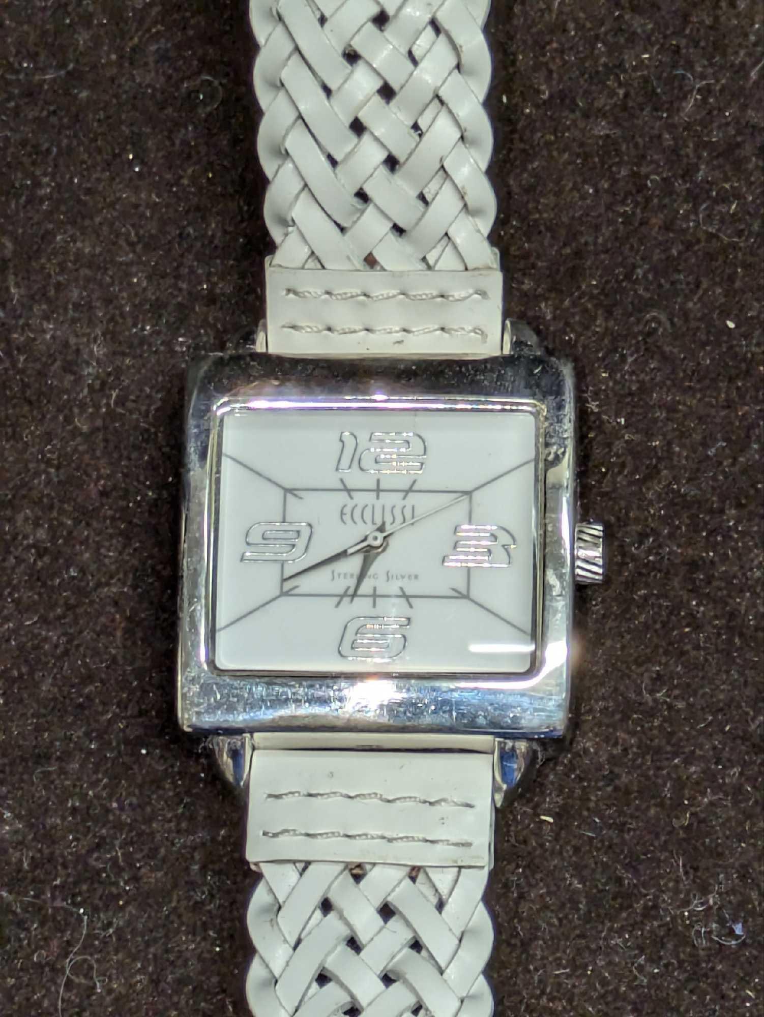 Ecclissi Sterling Silver Watch With Leather Braided Band B: Ecclissi Sterling Silver Watch With Leather Braided Band B. Sterling Silver Case And Stainless Steel Case. Has Japanese Movement. Is approx 1 1/4" x 1/4" x 9" and it weighs 0.05lb. Both the band and c