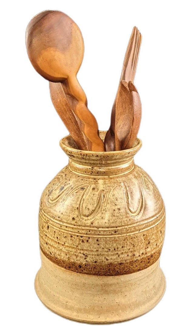 Ceramic Hand Made Pottery Utensil Holder: Ceramic Hand Made Pottery Utensil Holder. The maker and date of creation are unknown. Comes with three wooden spoons and a serving fork. The holder is approx 7" x 7" x 8 1/2". Utensils start at "12" w