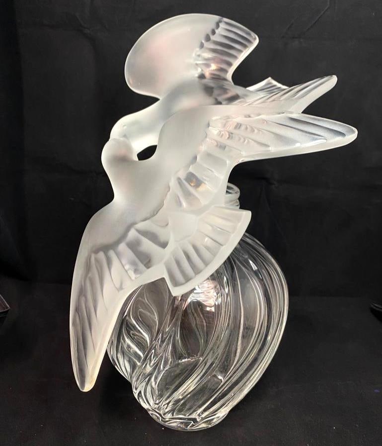 Lalique "L'air Du Temps" Crystal Display 12": Lalique "L'air Du Temps" Crystal Display 12" Large display bottle for the Nina Ricci perfume, L'air Du Temps, made by Lalique in France. Features a clear glass bottle, with a larg