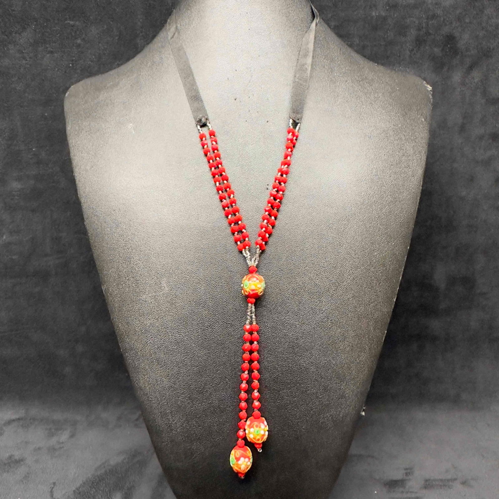 Venetian Murano Lamp Work Art Glass Red Beaded Pendant Necklace H37: Venetian Murano Lamp Work Art Glass Red Beaded Pendant Necklace H37. Necklace with red colored glass beads with beautiful designs on each. The necklace features gold toned accents. The necklace featur
