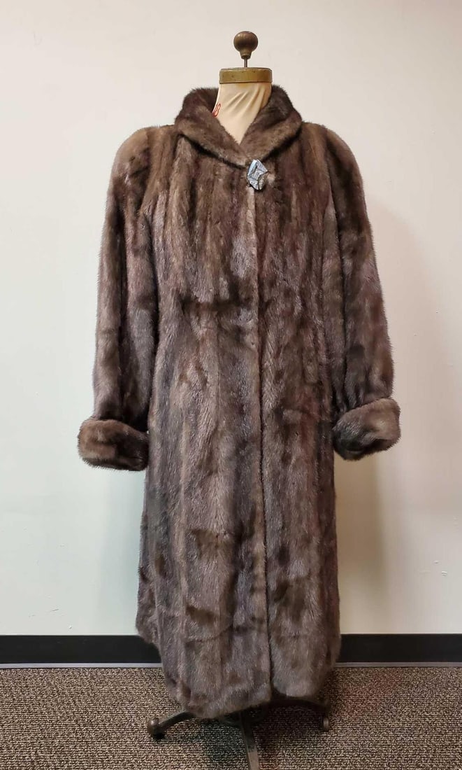 Taupe Mink Coat by Pageau Fine Furs Lachine: This full length taupe dyed mink fur coat by Pagaeu Fine Furs features lovely brown and black floral linen interior, 1 gray with gold tone detail button (70's look), 3 hook and loops for closure and 2