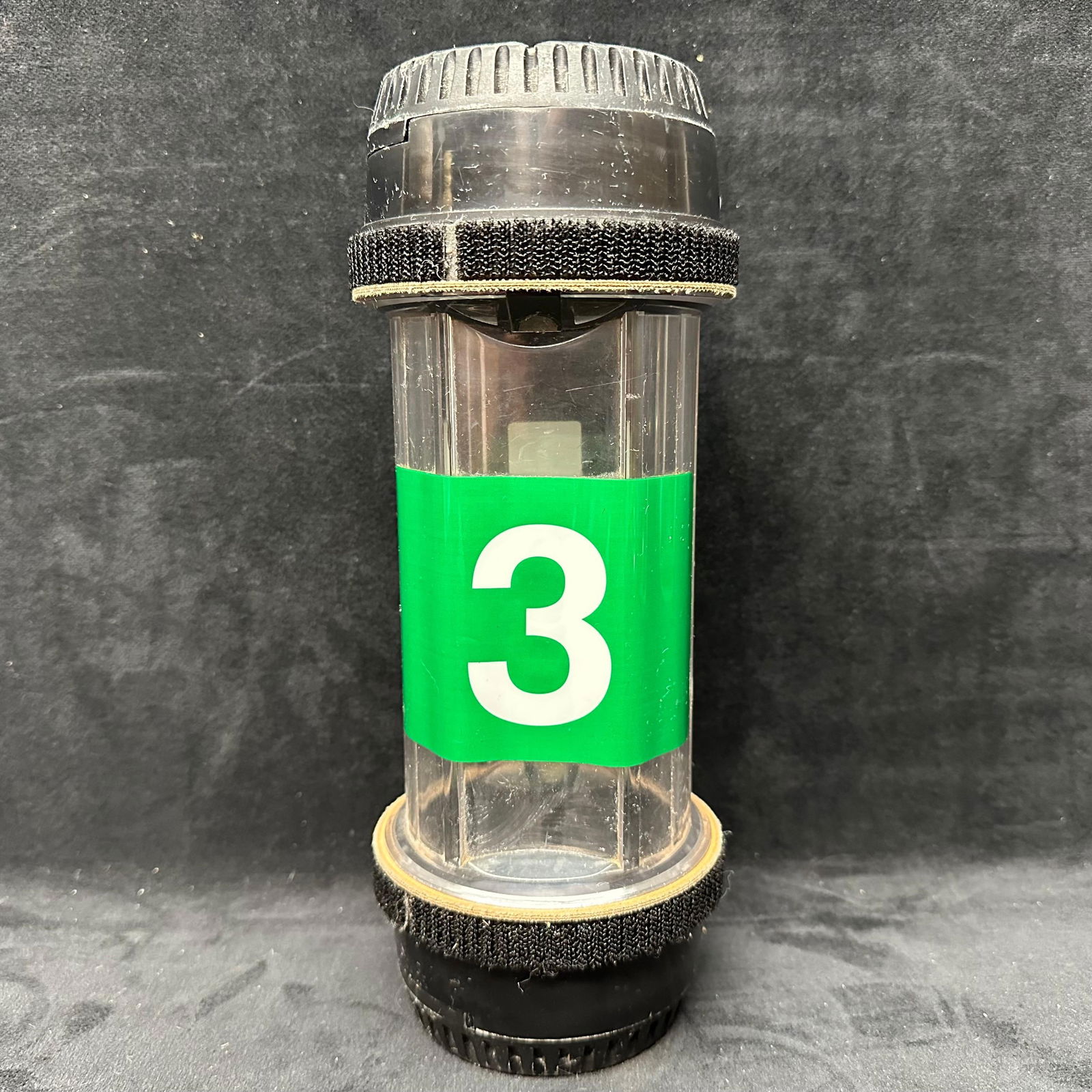 Diebold 3 Clear Plastic Bank Coin Dollar Tube Drive Thru Banking Canister: Diebold No. 3 clear plastic bank coin/bank note tube with black locking end caps. Cylindrical tube with internal dividers, originally used for bank coin/bank note handling and storage. Shows surface w
