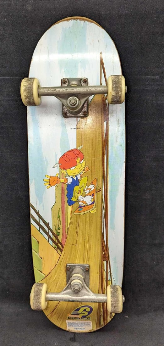 Variflex Rugrats Rocket Power Skateboard: Variflex Rugrats Rocket Power Skateboard. Is approx 8" x 28" x 3 1/2" and it weighs 3lbs. There is some wear on the grip tape, deck, and wheels, along with small cracks on the deck and surface