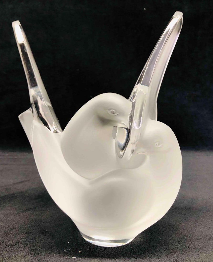 Lalique Signed Sylvie Vase: This lot contains a Lalique Signed Sylvie Vase. It is approx 7" x 4" x 8 1/4" and it weighs about 5lbs. Overall the Lalique Vase is in good used condition with some light wear from use over