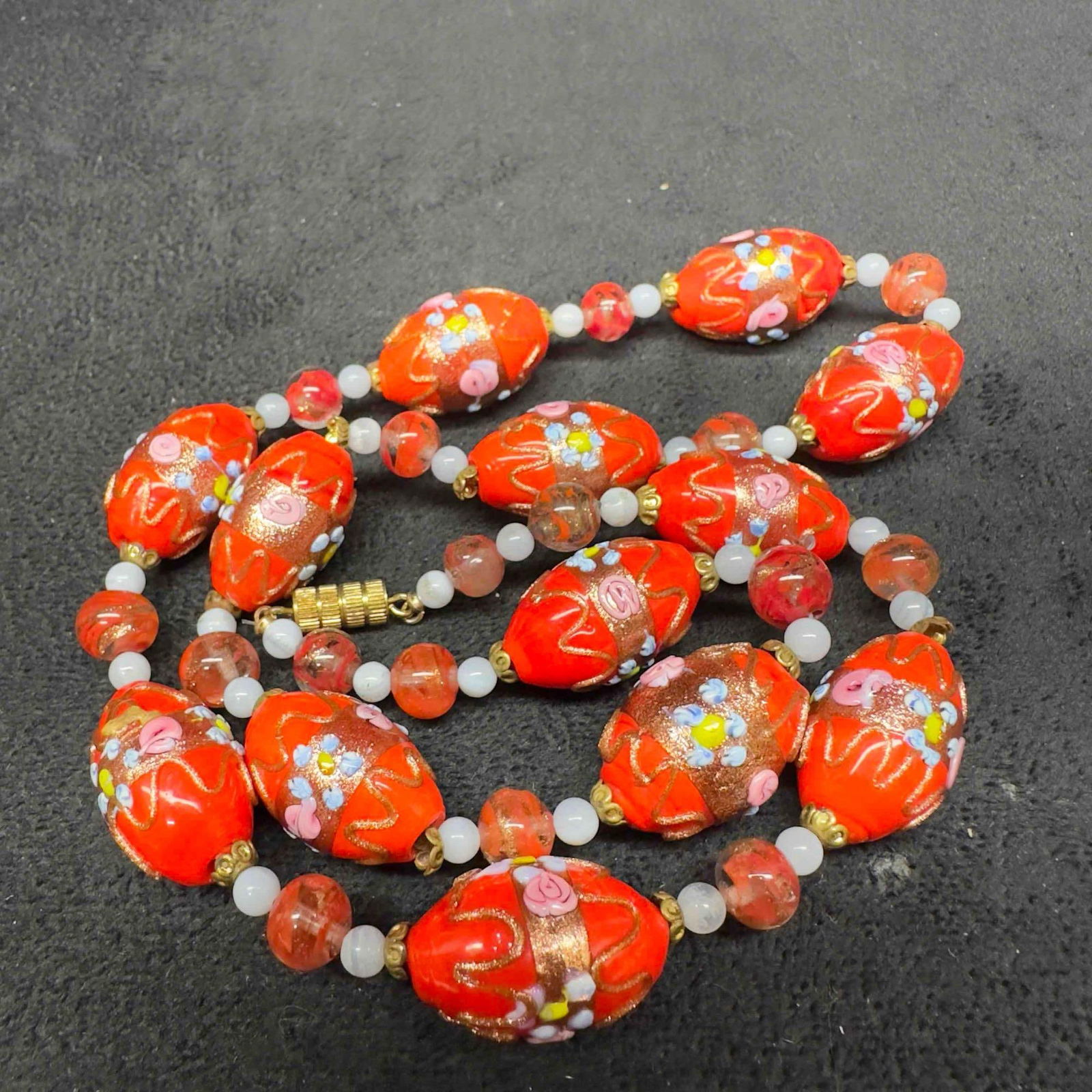 Venetian Murano Lamp Work Art Glass Bead Fiorato Oval Floral Red Beaded Necklace B96: Venetian Murano Lamp Work Art Glass Bead Fiorato Oval Floral Red Beaded Necklace B96. Necklace with red colored glass beads with beautiful hand painted designs on each. The necklace feature floral acc
