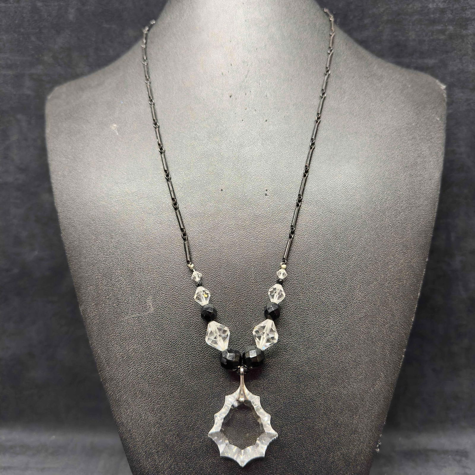 Black Glass Crystal Bead Costume Jewelry Pendant Necklace H74: Black Glass Crystal Bead Costume Jewelry Pendant Necklace H74. Necklace with black and clear colored glass beads with beautiful designs. The necklace features a barrel clasp closure and a uniquely