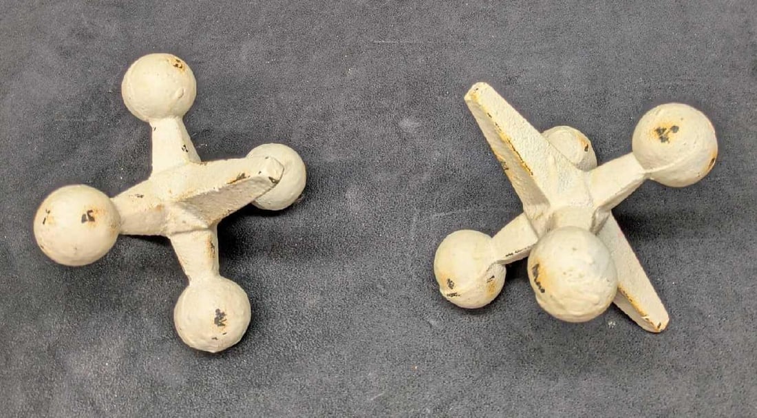 2 Distressed White Vintage Cast Iron Jacks: 2 Distressed White Vintage Cast Iron Jacks. The maker and date of creation is unknown. Each is approx 4 1/4" x 5" x 5" and the total weight is 7.20lbs. The jacks have surface rust, and color loss.