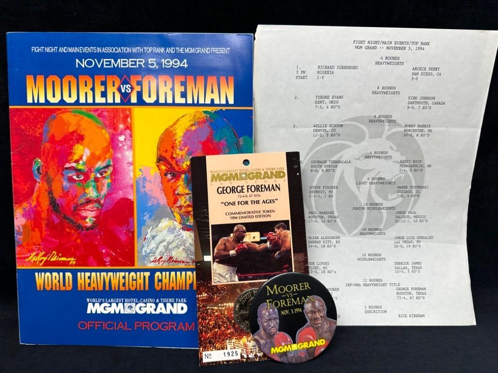 Signed George Foreman Program, Token, Button 1994: Signed George Foreman Program, Token, Button 1994 Fight program from November 5th, 1994, signed by George Foreman inside. Comes with the official fight card printed on MGM Grand stationary, as